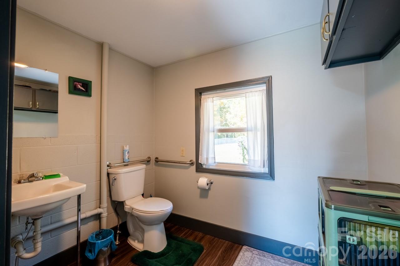 240 Eldon Lane Salisbury, NC 28144 - Photo 37 of 41 a bathroom with a toilet a sink and a window