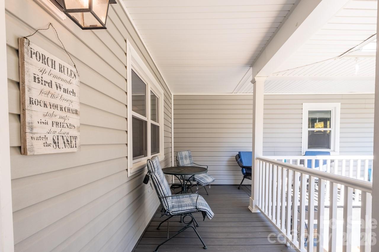 240 Eldon Lane Salisbury, NC 28144 - Photo 7 of 41 a view of a balcony with chairs and wooden fence