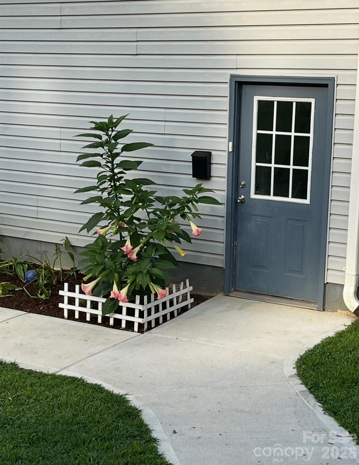 240 Eldon Lane Salisbury, NC 28144 - Photo 8 of 41 a front view of a house with a yard and garage