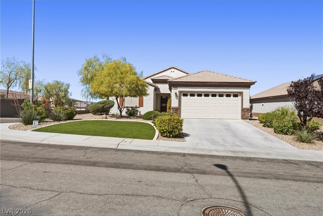 2541 Darda Street Henderson, NV 89044 - Photo 24 of 26 This appealing residence features an attached garage and a well-maintained front yard.