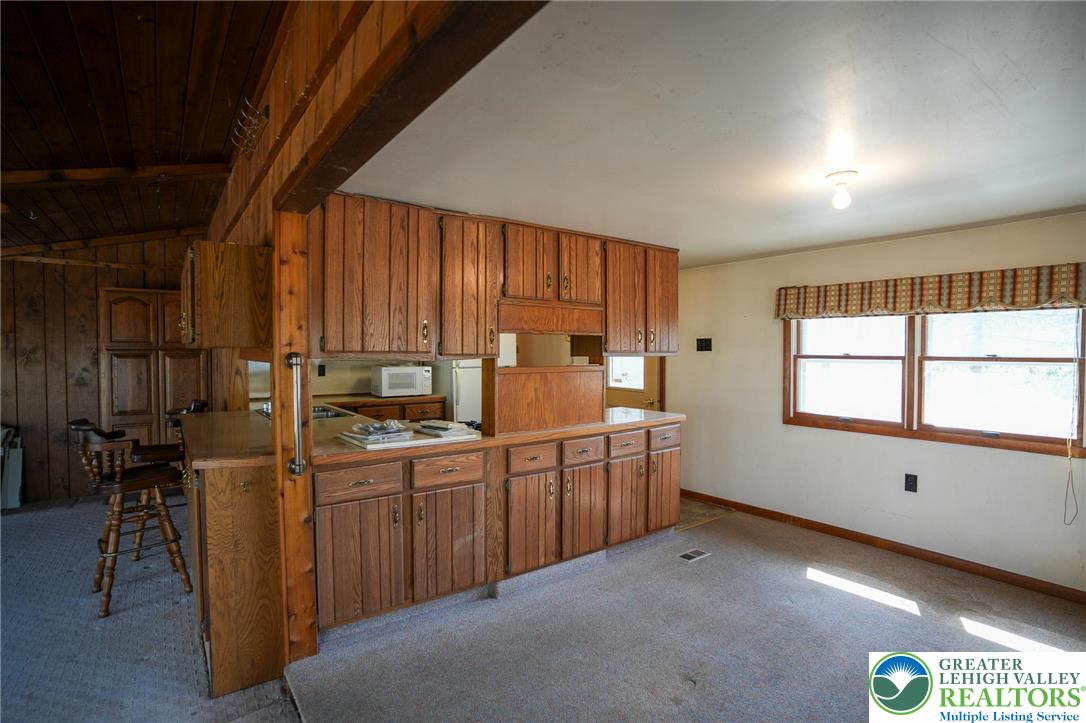 8245 Interchange Road Lehighton, PA 18235 - Photo 16 of 35 a kitchen with sink cabinets and window