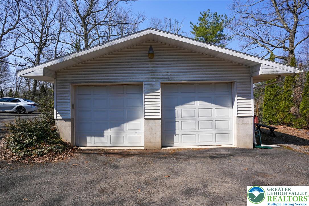 8245 Interchange Road Lehighton, PA 18235 - Photo 7 of 35 a front view of a house with a yard and garage