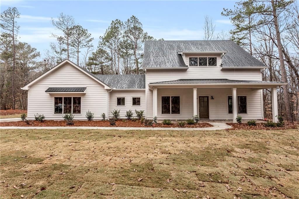 1620 Lower Apalachee Road Madison, GA 30650 - Photo 1 of 1 a front view of a house with a yard