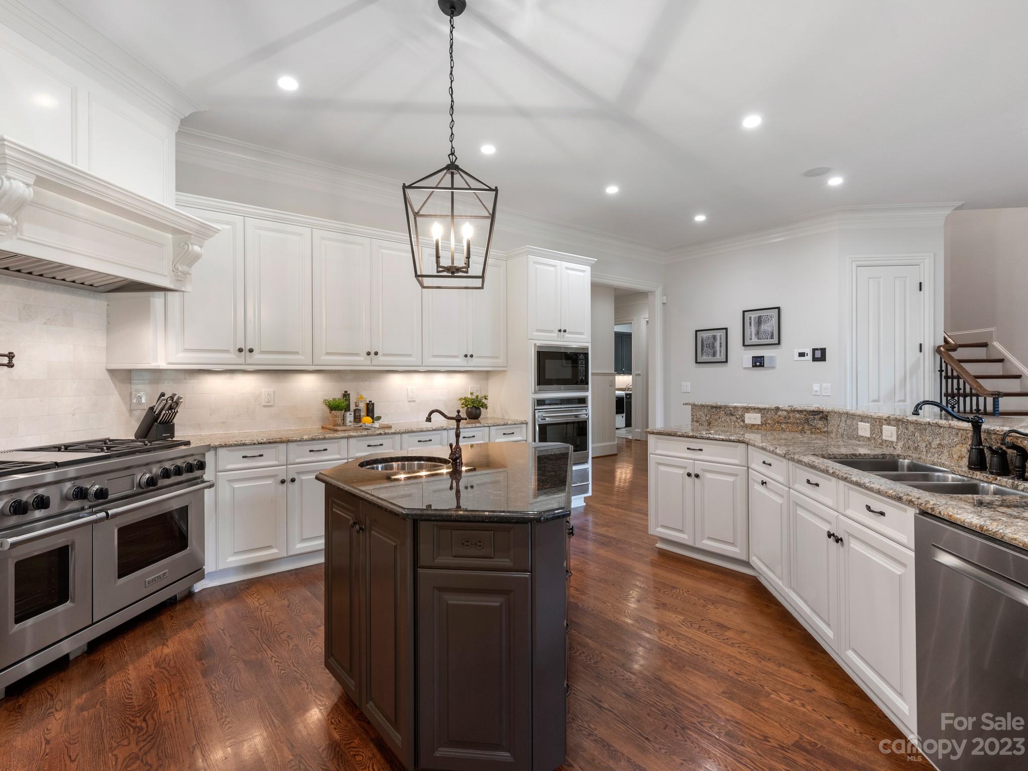304 Eagle Bend Drive Waxhaw, NC 28173 - Photo 15 of 48 a kitchen with stainless steel appliances granite countertop a sink stove and refrigerator