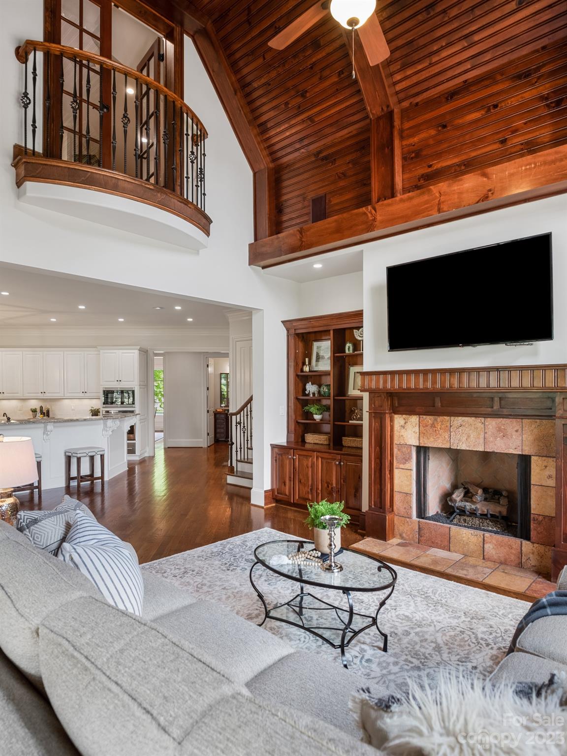 304 Eagle Bend Drive Waxhaw, NC 28173 - Photo 18 of 48 a living room with furniture a flat screen tv and a fireplace