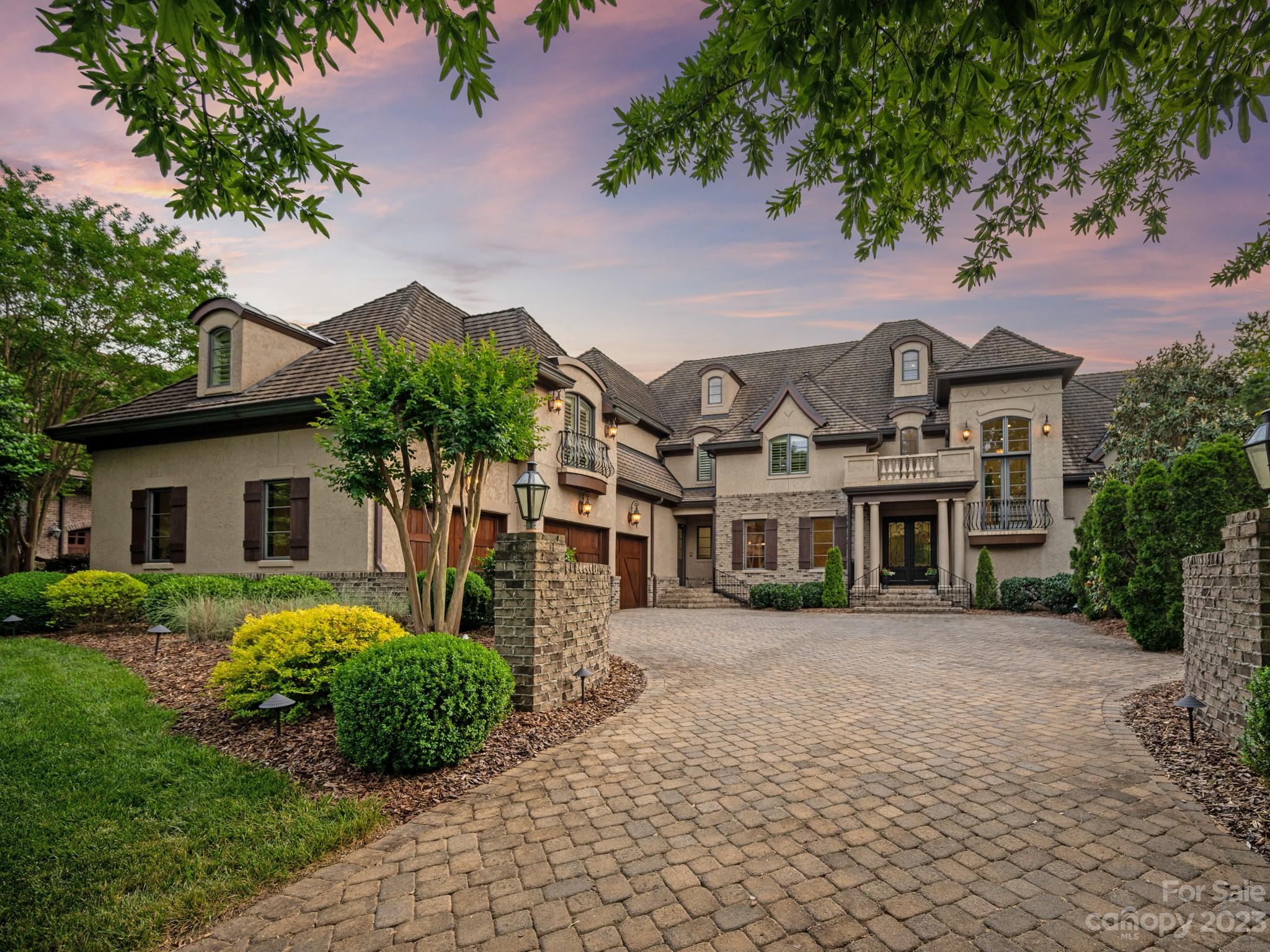 304 Eagle Bend Drive Waxhaw, NC 28173 - Photo 3 of 48 a view of a white house next to a yard with plants and trees