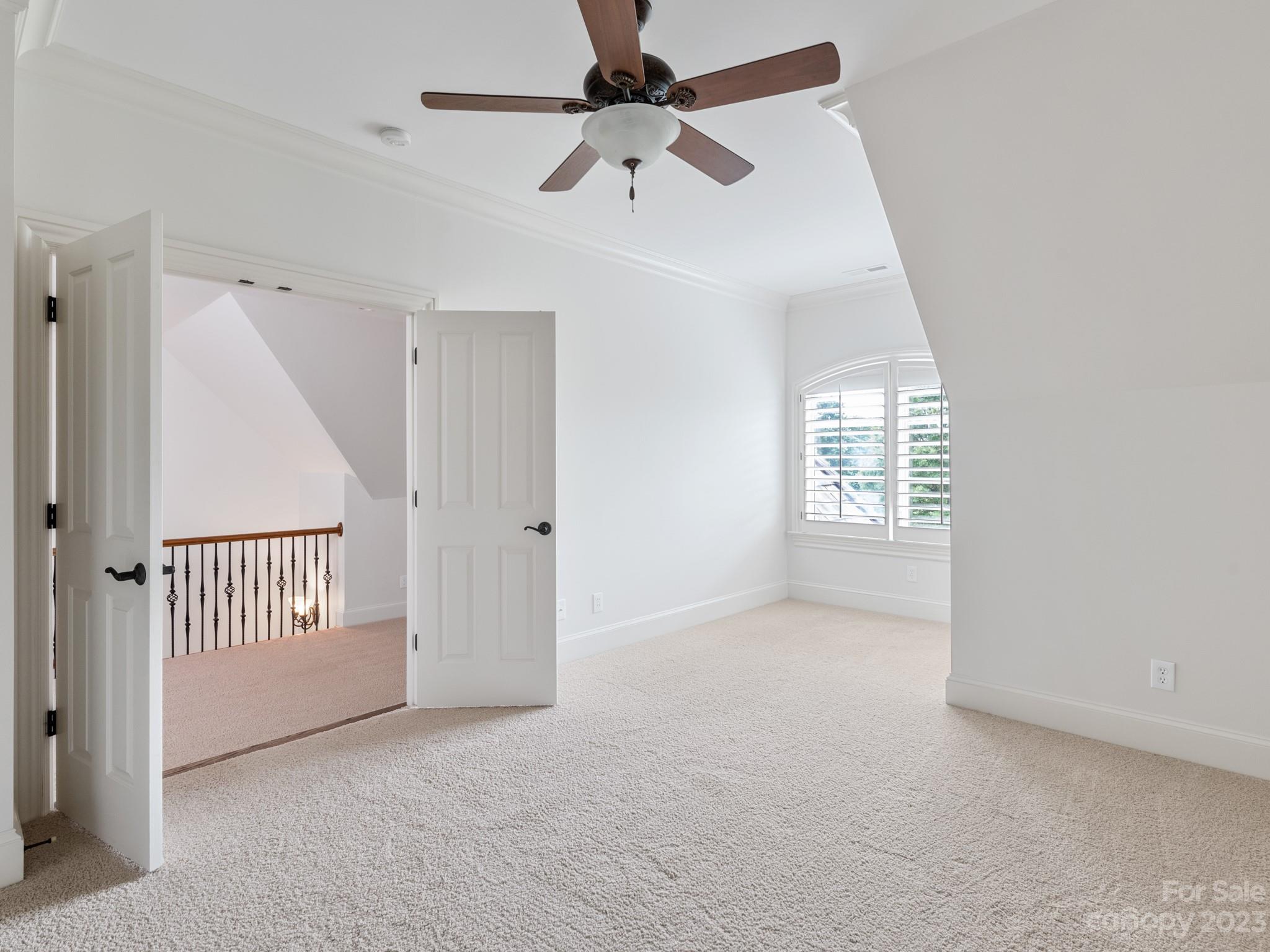 304 Eagle Bend Drive Waxhaw, NC 28173 - Photo 41 of 48 an empty room with windows and fan
