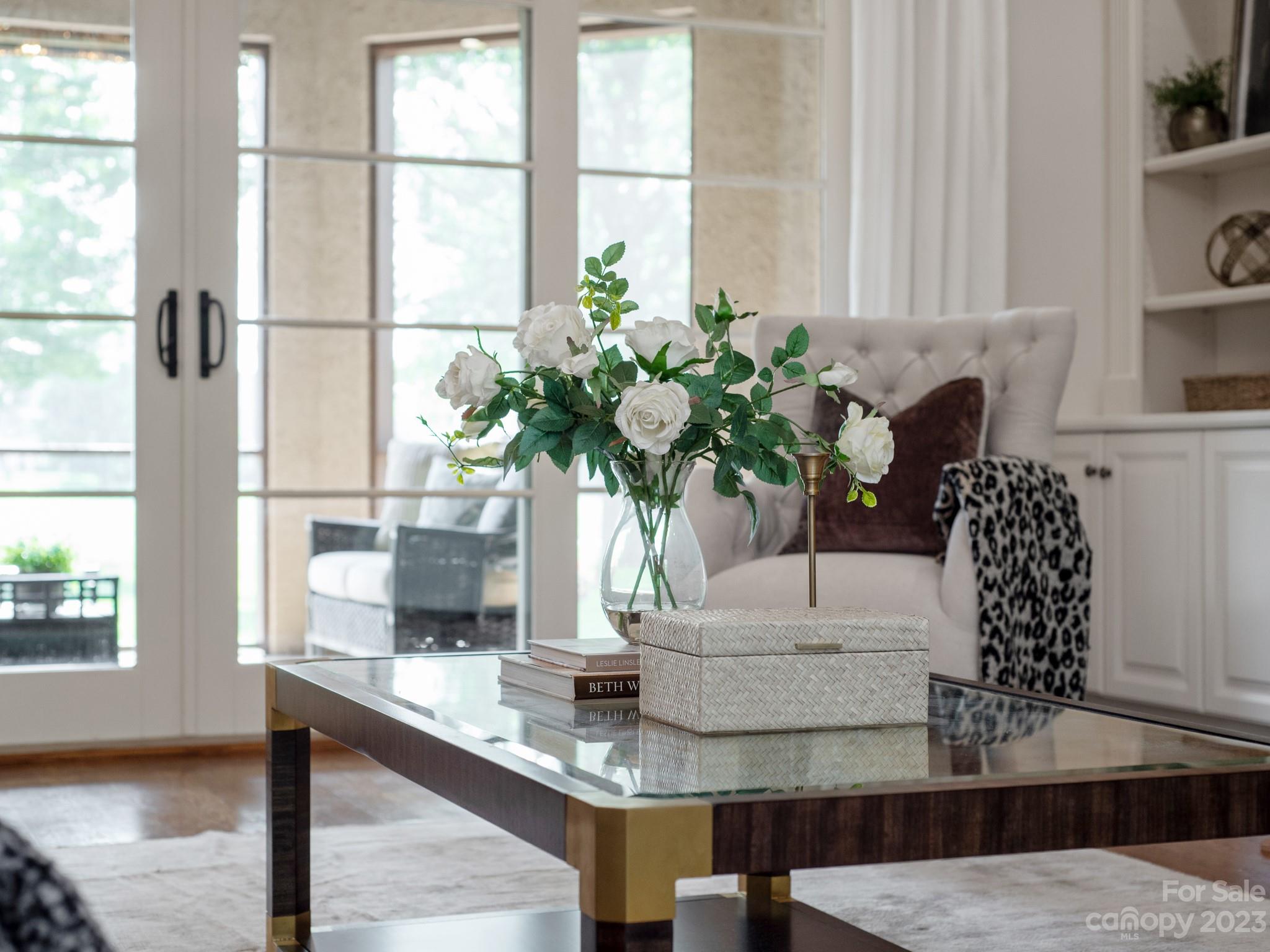 304 Eagle Bend Drive Waxhaw, NC 28173 - Photo 9 of 48 a vase of flowers sitting on a table with window