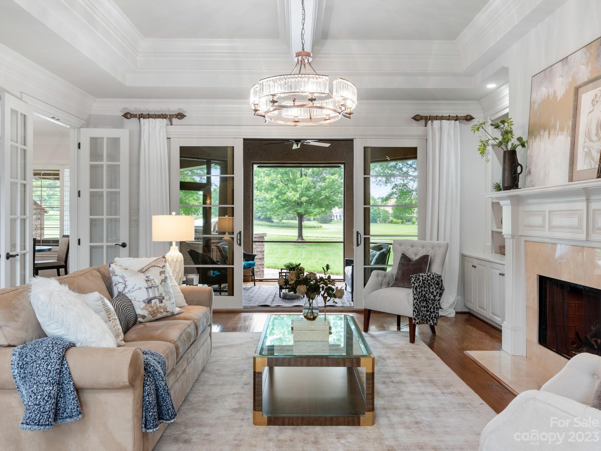 304 Eagle Bend Drive Waxhaw, NC 28173 - Photo 10 of 48 a living room with furniture a fireplace and a large window
