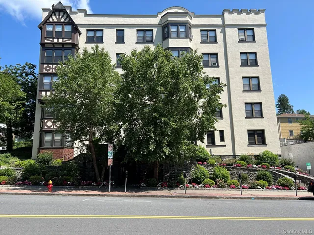 a front view of a building with street view