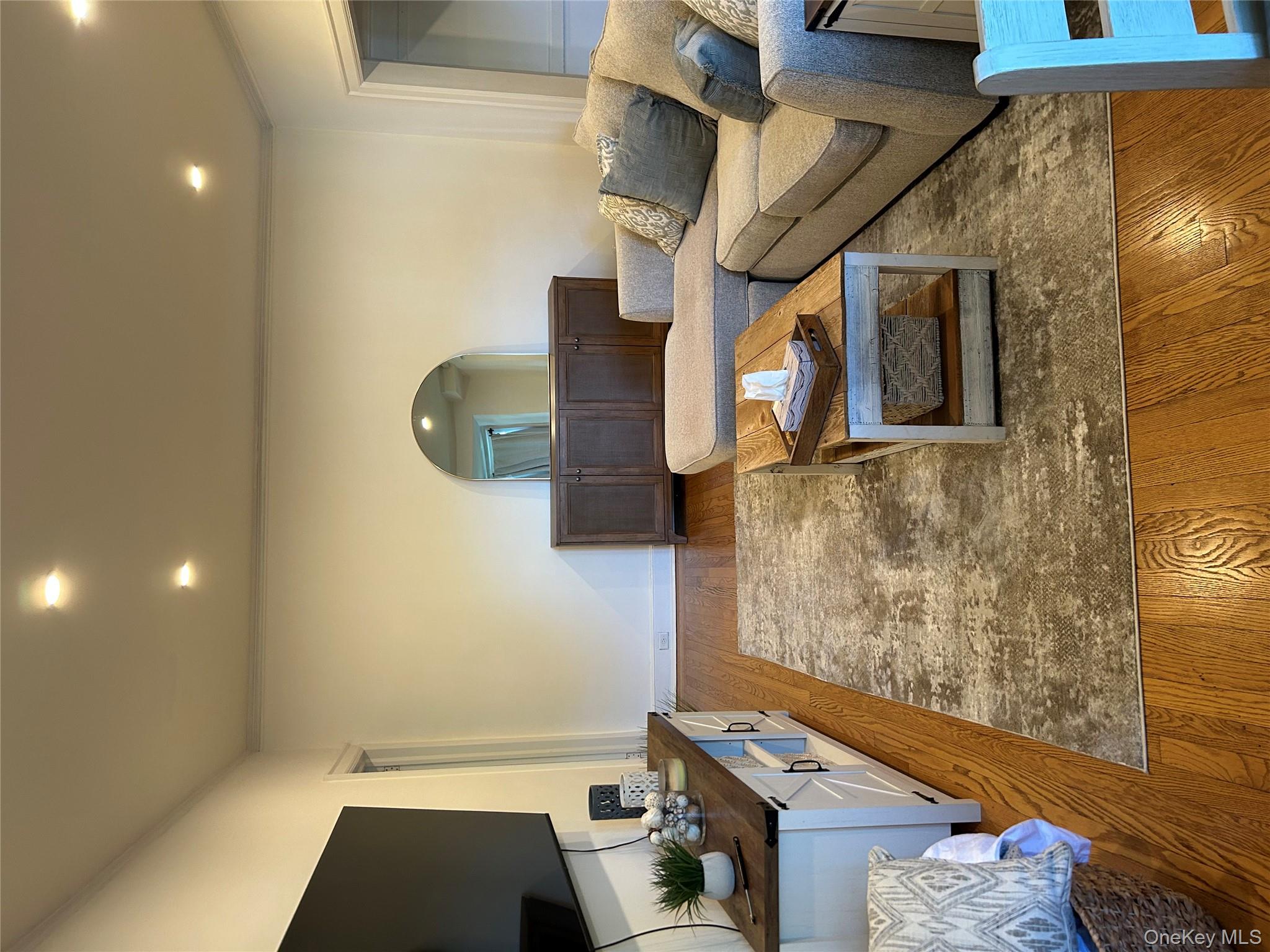 56 Pondfield Road West, Unit 4A Bronxville, NY 10708 - Photo 11 of 22 a living room with furniture and a flat screen tv