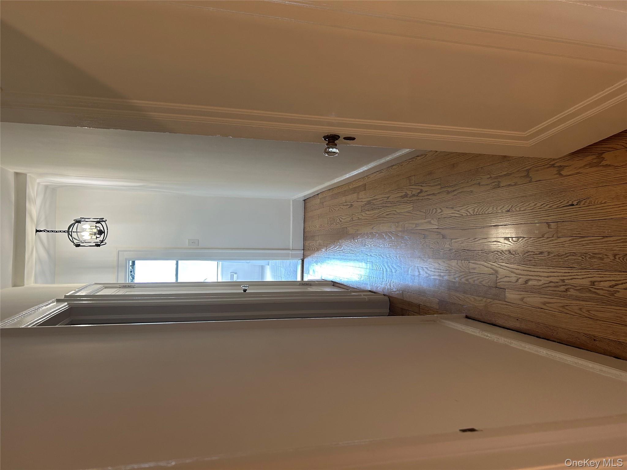 56 Pondfield Road West, Unit 4A Bronxville, NY 10708 - Photo 12 of 22 a view of a hallway with wooden floor