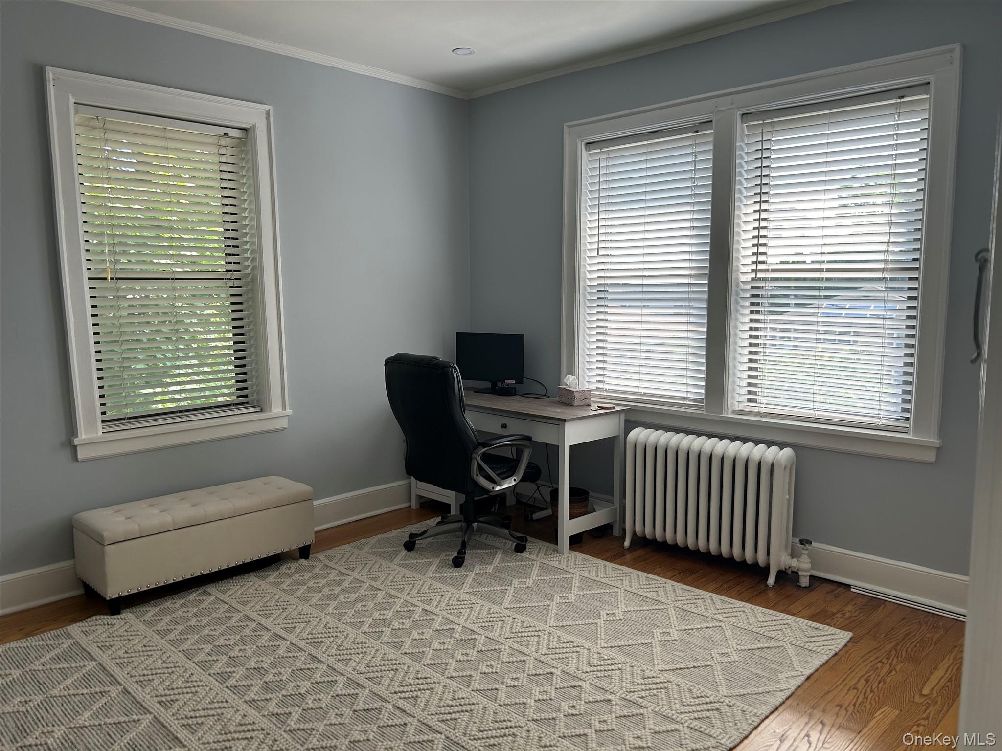 56 Pondfield Road West, Unit 4A Bronxville, NY 10708 - Photo 16 of 22 a bedroom with a chair and a window