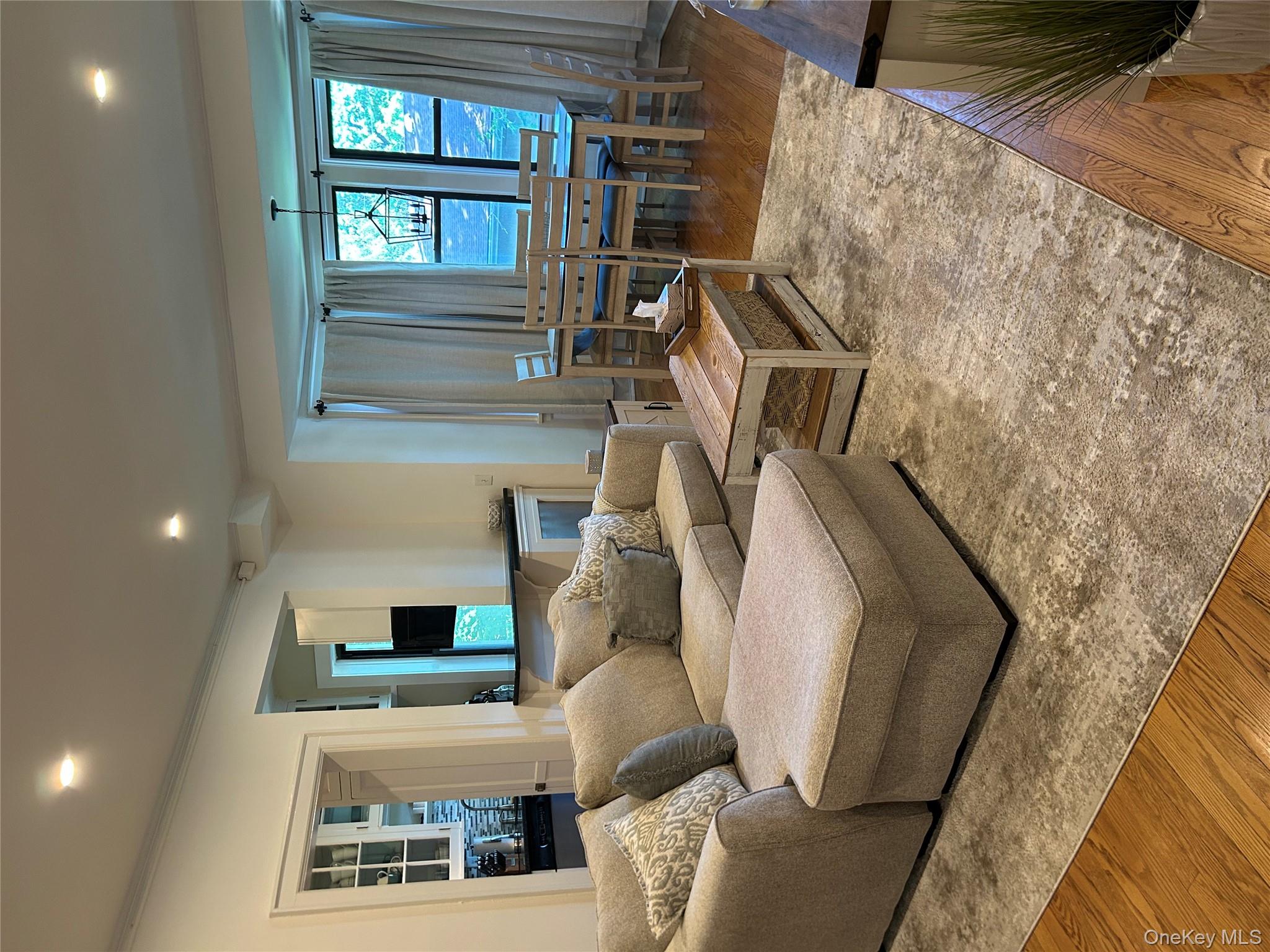 56 Pondfield Road West, Unit 4A Bronxville, NY 10708 - Photo 17 of 22 a living room with furniture and wooden floor