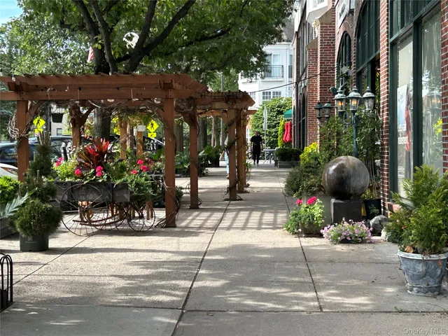 a view of street with flower on side of it
