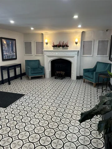 a living room with a couch and a fireplace