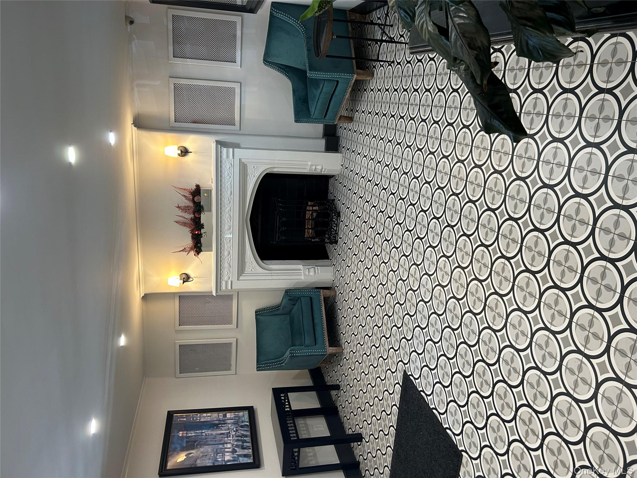 56 Pondfield Road West, Unit 4A Bronxville, NY 10708 - Photo 4 of 22 a living room with a couch and a fireplace