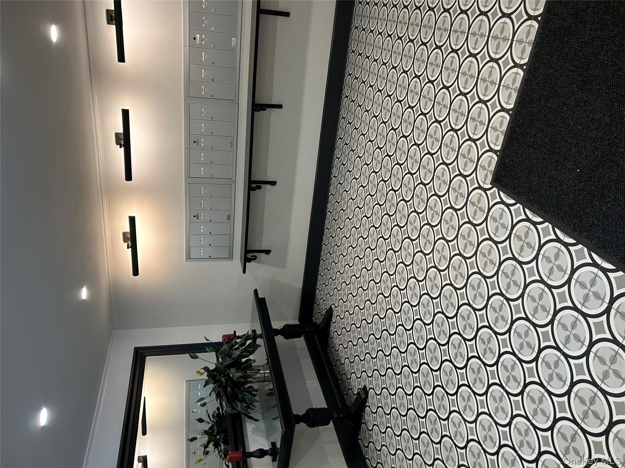 56 Pondfield Road West, Unit 4A Bronxville, NY 10708 - Photo 5 of 22 a bathroom with a sink a toilet and a mirror