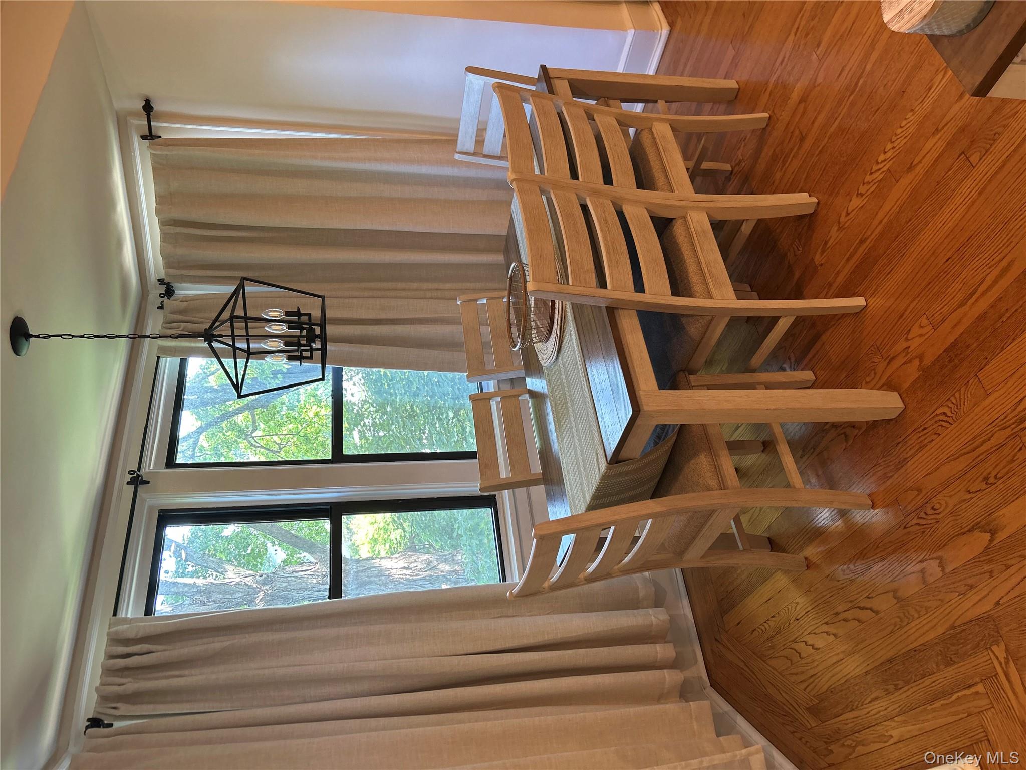 56 Pondfield Road West, Unit 4A Bronxville, NY 10708 - Photo 9 of 22 a view of a dining room with furniture window and wooden floor