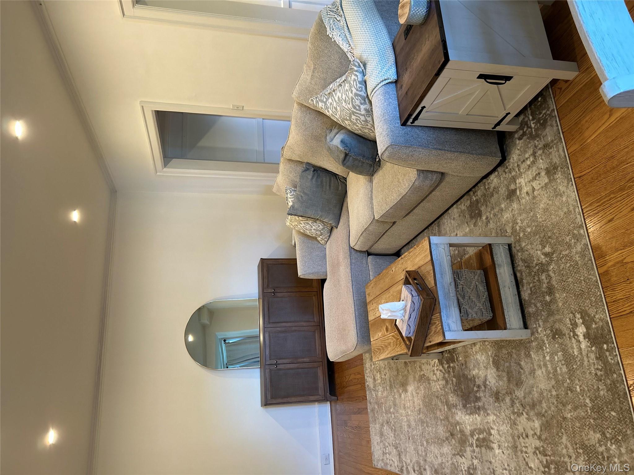 56 Pondfield Road West, Unit 4A Bronxville, NY 10708 - Photo 10 of 22 a living room with furniture and a couch