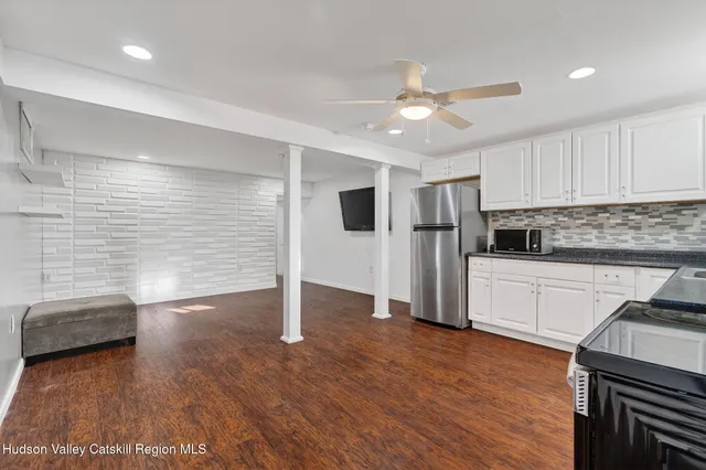 a bathroom with a shower and a glass door