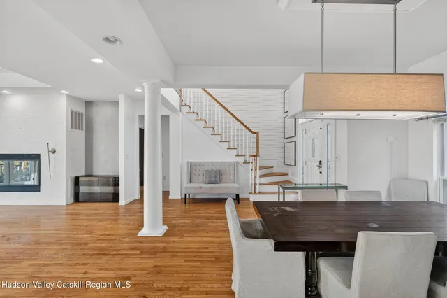 a living room with stainless steel appliances kitchen island granite countertop furniture and a kitchen view