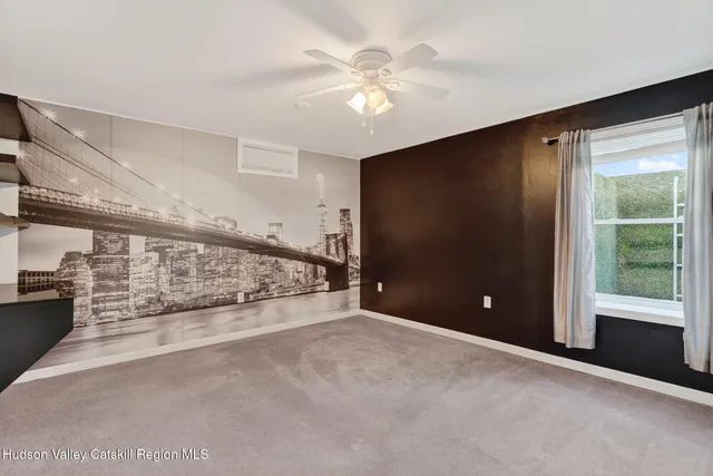a front view of a house with a yard and balcony