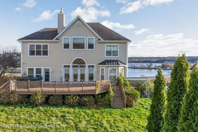 a view of a balcony with wooden floor
