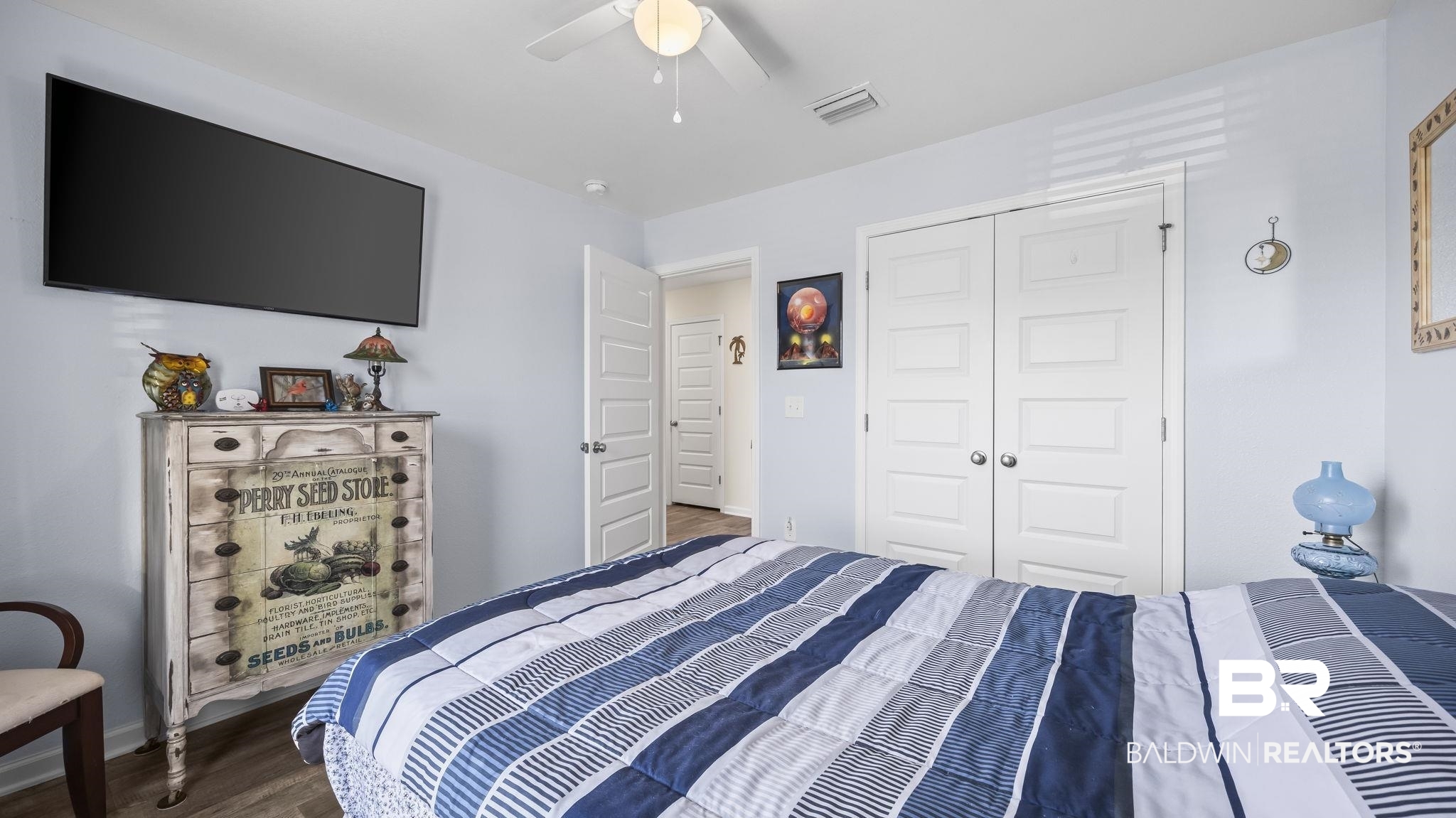 349 Hartenstein Road Foley, AL 36535 - Photo 14 of 32 Bedroom with wood finished floors, a ceiling fan, and a closet