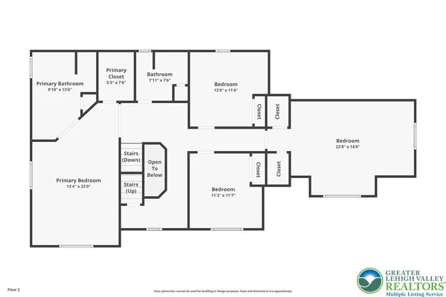 a spacious bedroom with a bed and a dresser next to a window