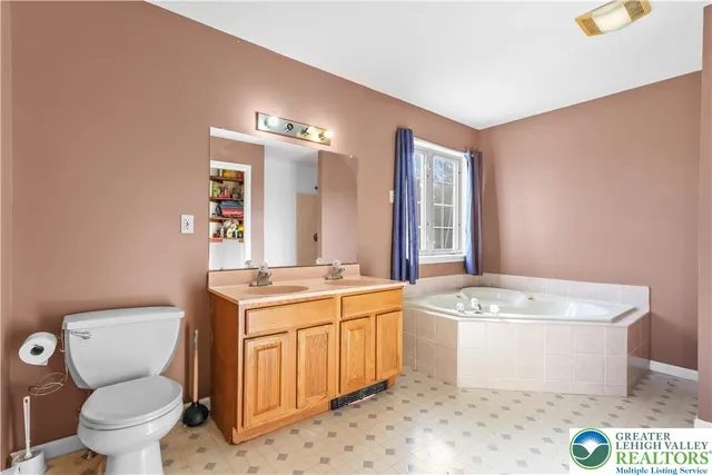 a bath tub sitting next to a shower