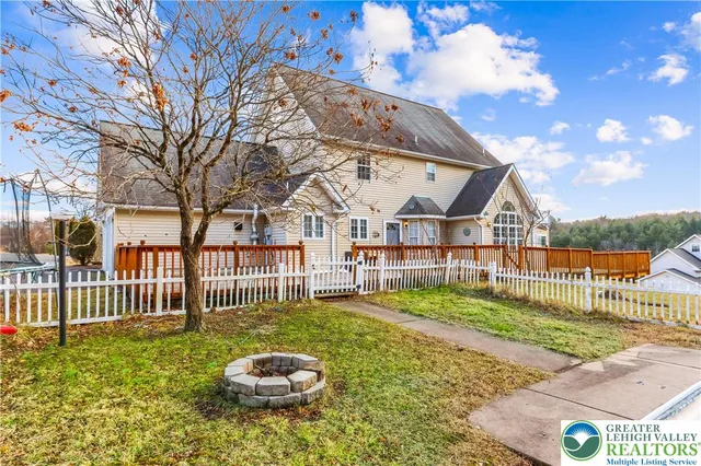 a view of swimming pool with outdoor seating