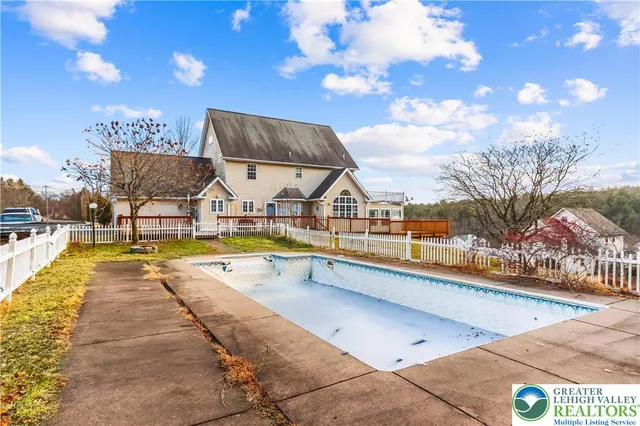 a view of a house with swimming pool