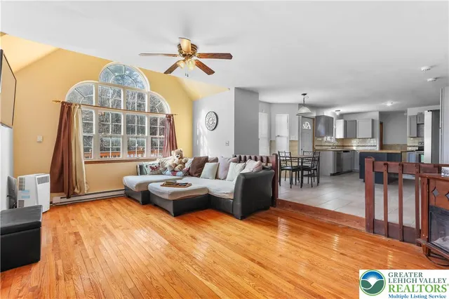 a living room with furniture and a table