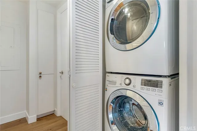 a view of a hallway with a couch and a mirror