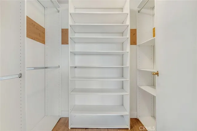 a living room with fireplace furniture and a chandelier
