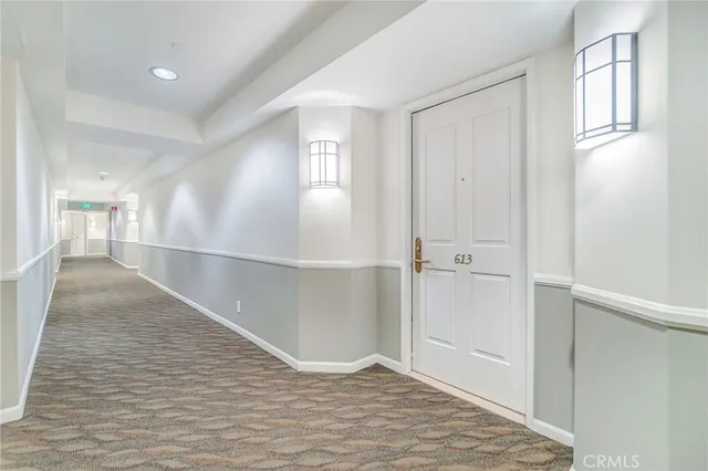 a kitchen with stainless steel appliances kitchen island granite countertop a stove and a sink