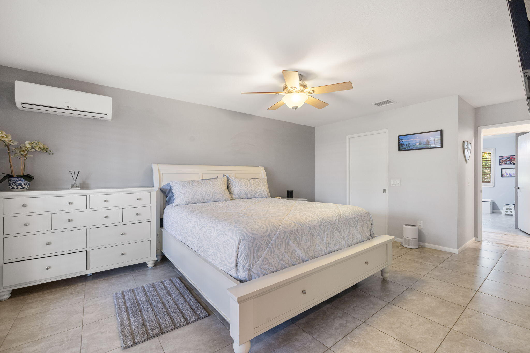 42230 May Pen Road Bermuda Dunes, CA 92203 - Photo 22 of 57 a bedroom with a bed and a chandelier