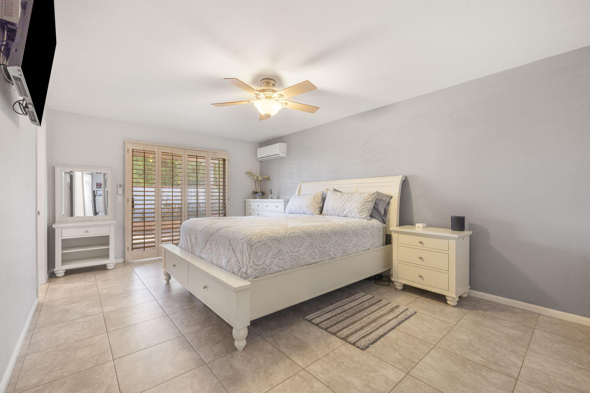 42230 May Pen Road Bermuda Dunes, CA 92203 - Photo 23 of 57 a bedroom with a bed and a chandelier