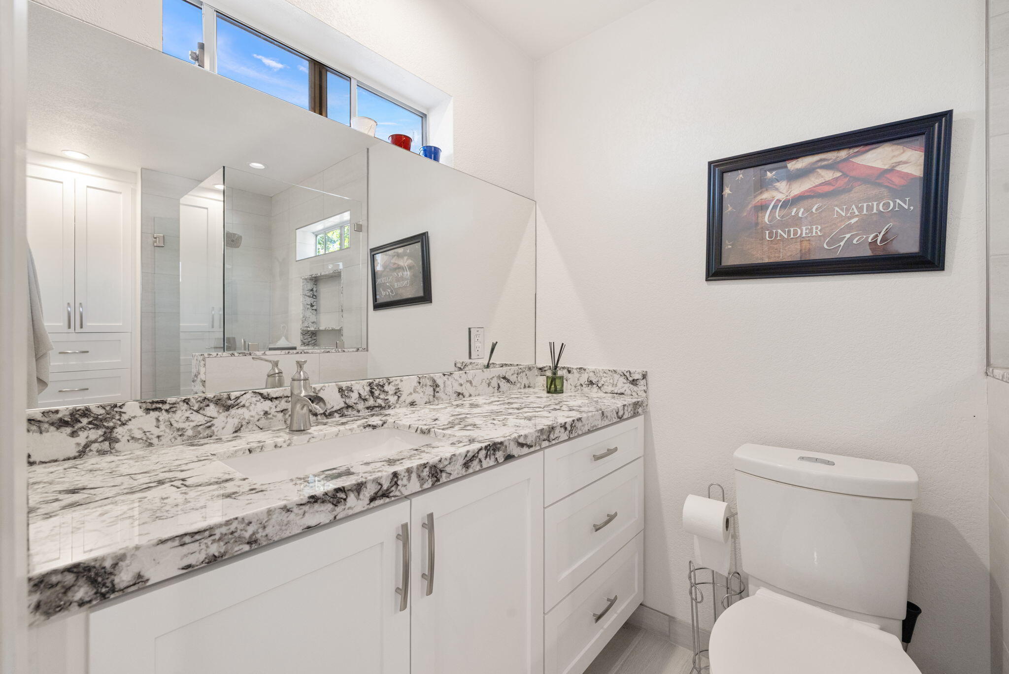 42230 May Pen Road Bermuda Dunes, CA 92203 - Photo 35 of 57 a bathroom with a granite countertop toilet sink and a mirror