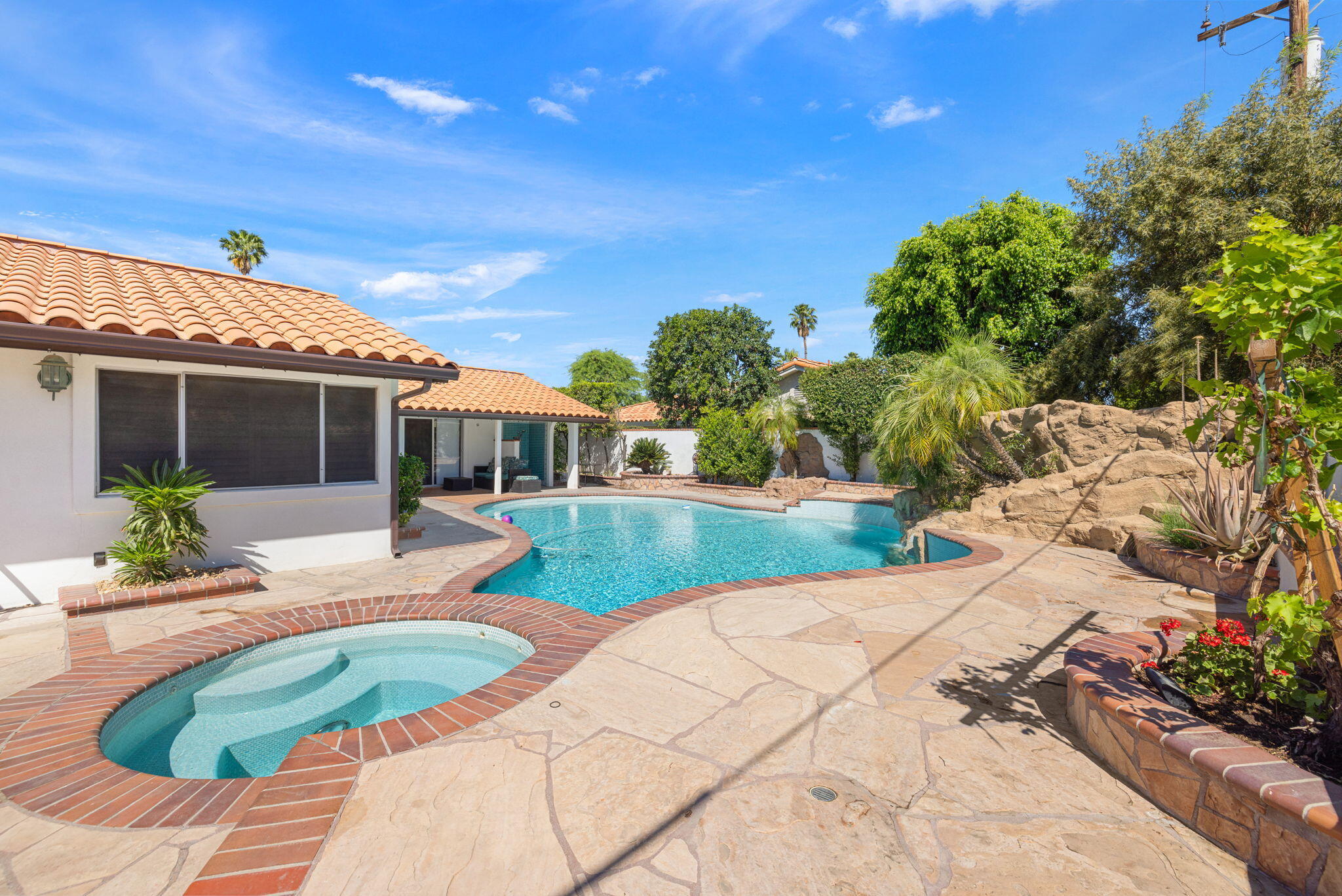 42230 May Pen Road Bermuda Dunes, CA 92203 - Photo 41 of 57 a view of a house with backyard sitting area and garden