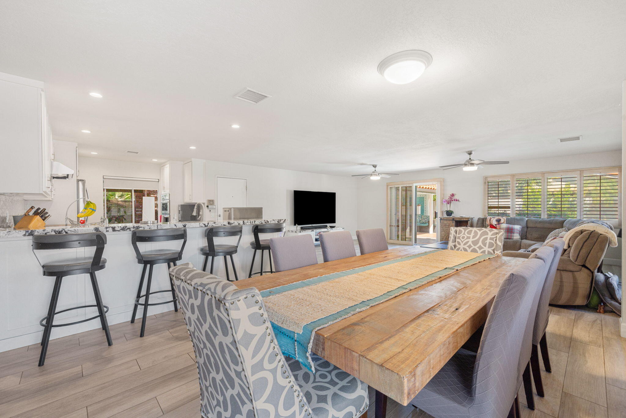 42230 May Pen Road Bermuda Dunes, CA 92203 - Photo 8 of 57 a living room with furniture a flat screen tv and a table