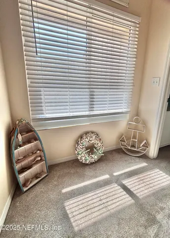 a bedroom with a bed flat screen tv and a couch