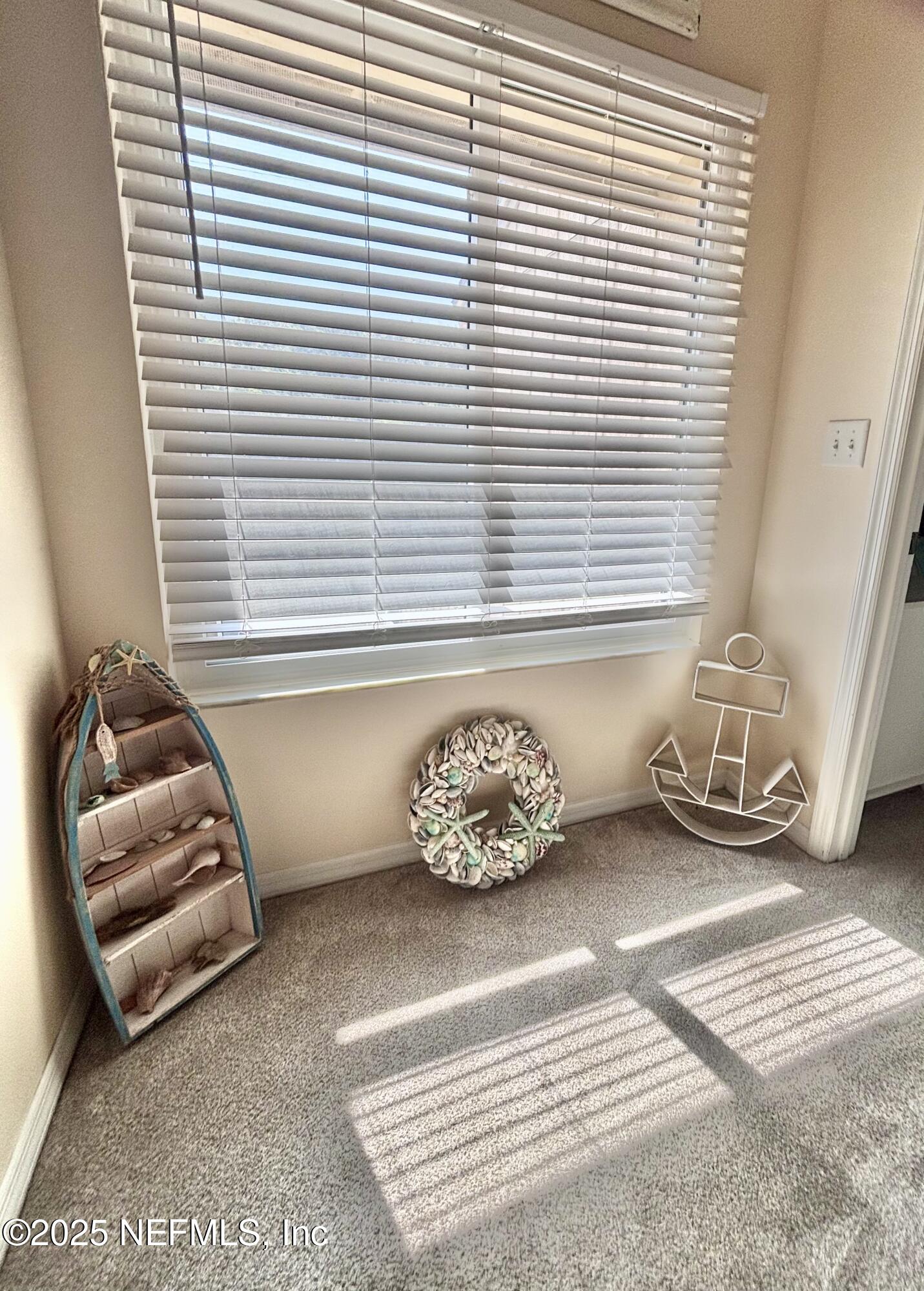 3165 1st Avenue, Unit 13 Fernandina Beach, FL 32034 - Photo 15 of 37 a bedroom with a bed and a window