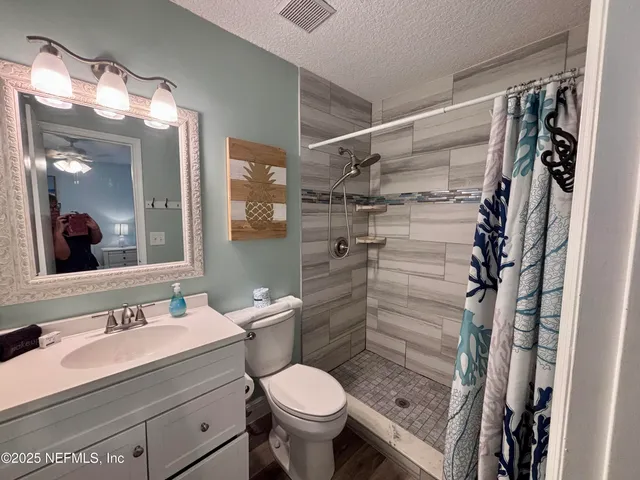 a bedroom with bed and window