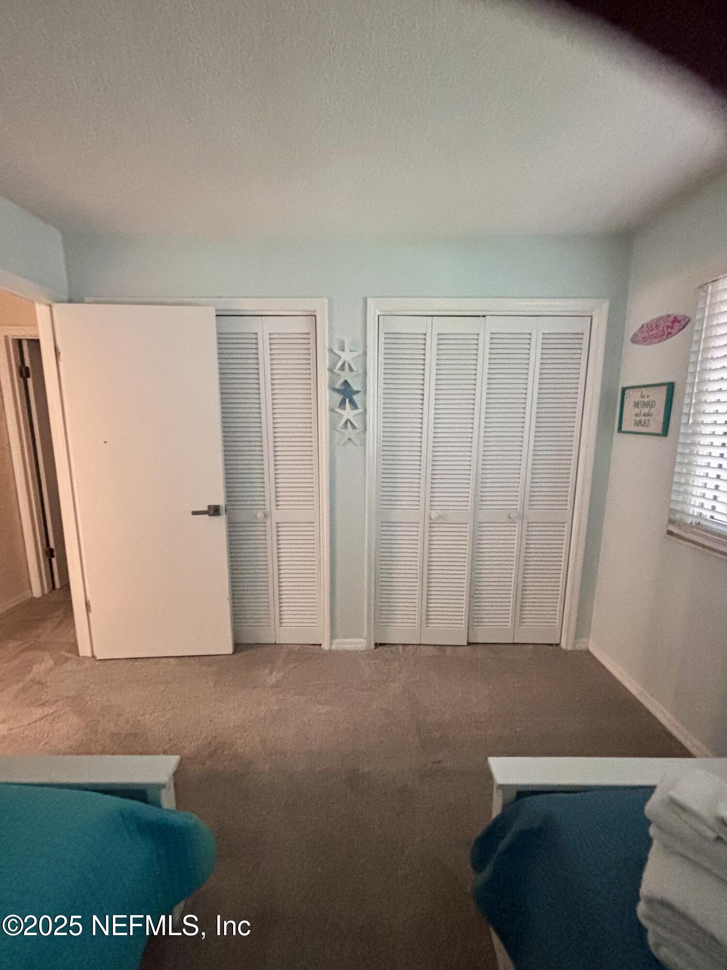 3165 1st Avenue, Unit 13 Fernandina Beach, FL 32034 - Photo 25 of 37 a view of room with window and a ceiling fan