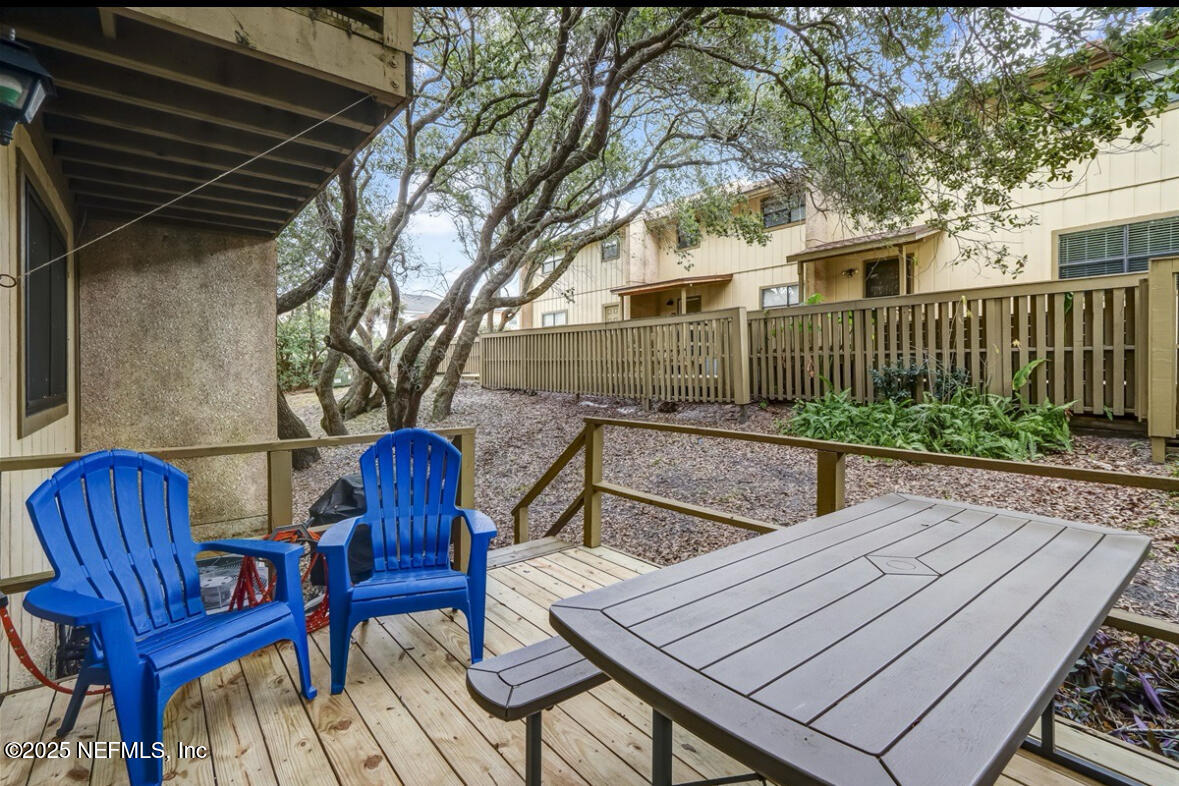 3165 1st Avenue, Unit 13 Fernandina Beach, FL 32034 - Photo 28 of 37 a view of backyard with deck and outdoor seating