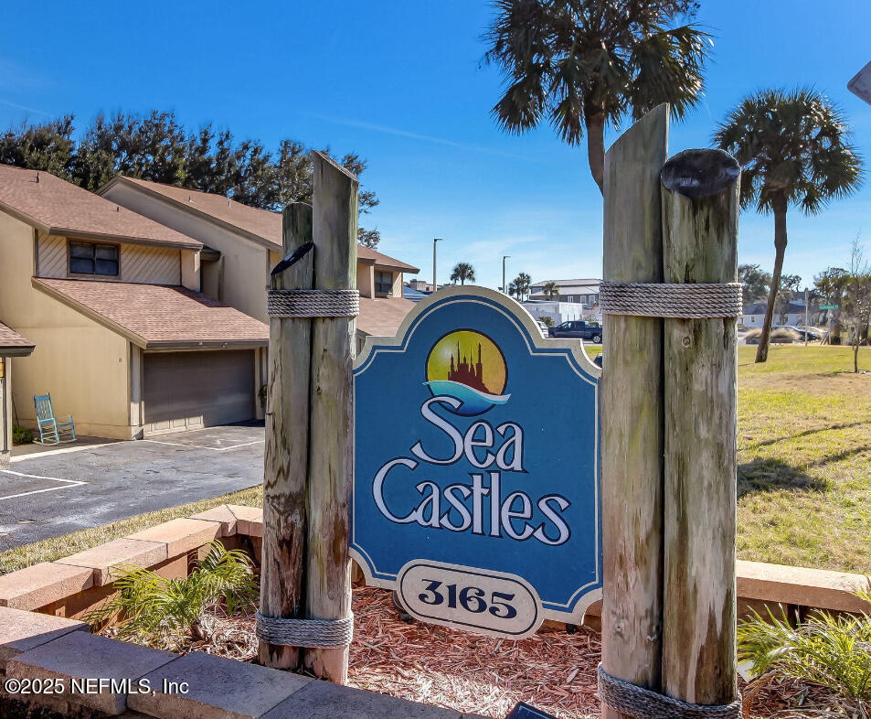 3165 1st Avenue, Unit 13 Fernandina Beach, FL 32034 - Photo 5 of 37 a view of outdoor space with sign board