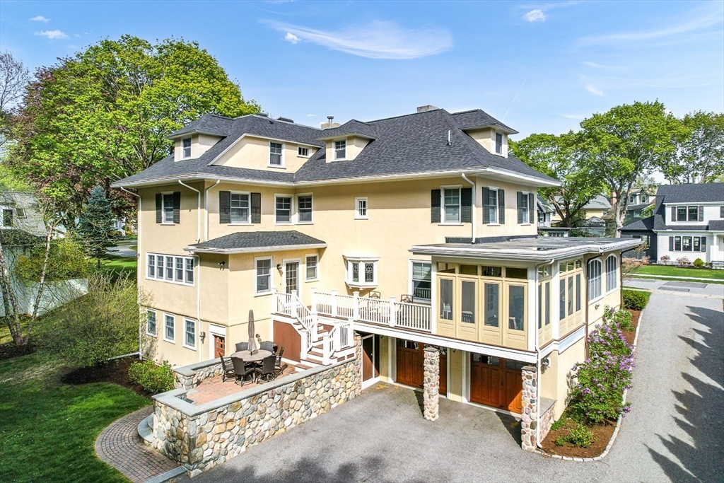 21 Sheffield West Winchester, MA 01890 - Photo 3 of 40 a front view of a house with a yard