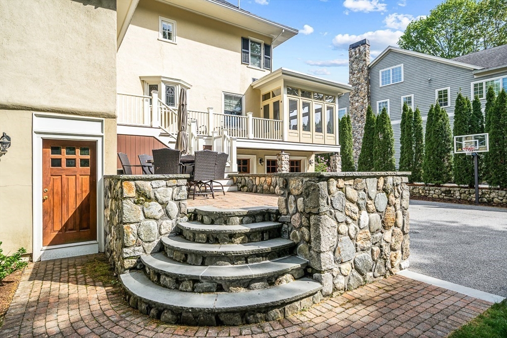 21 Sheffield West Winchester, MA 01890 - Photo 4 of 40 a view of a building with a fountain